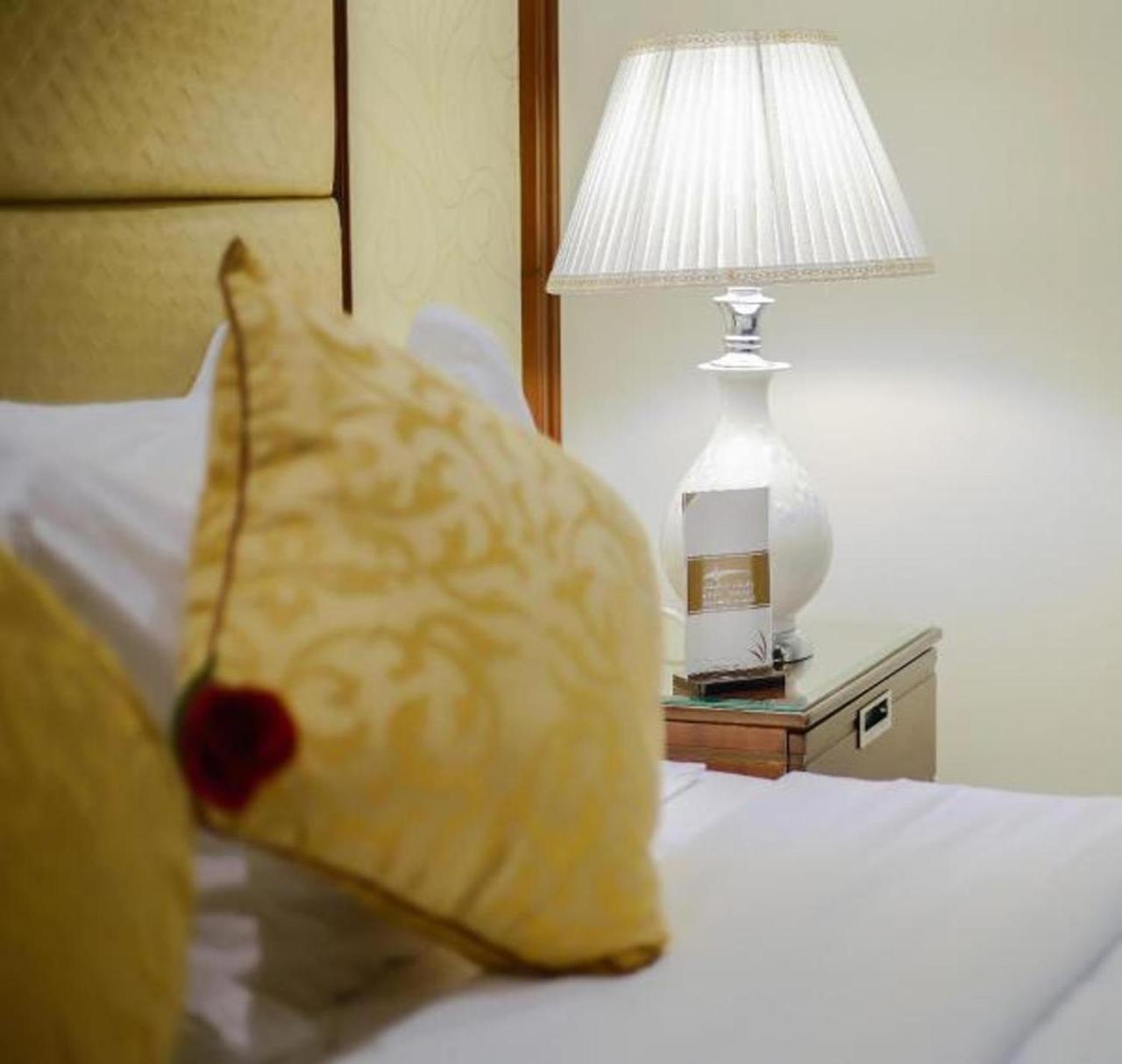 Rest Night Serviced Apartments- Alhamra Рияд Екстериор снимка A lamp on a bedside table